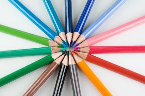 Set of colored pencils lined by an arc Stock Photos