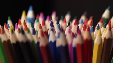 A Set of Colored Pencils Rotates. Dark Background. Macro Close-Up Stock-Footage 66764375