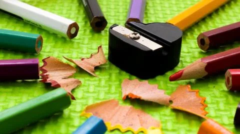 Set of colored pencils with sharpener Stock Photos