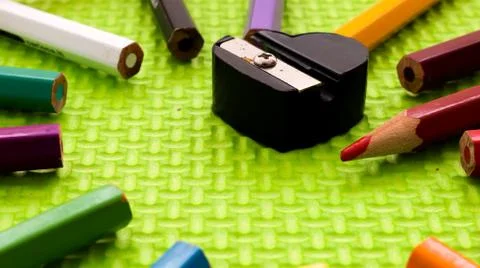 Set of colored pencils with sharpener Stock Photos