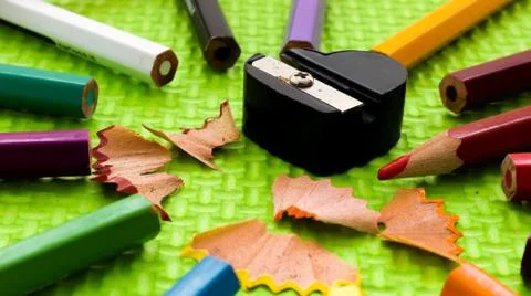 Set of colored pencils with sharpener Stock Photos