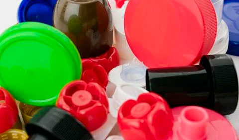 Set of colored plastic caps to recycle and care for the environment Stock Photos