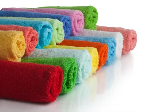 Set of colored towels on white. Stock Photos