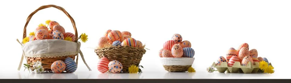 Set of colorful Easter Eggs in Rustic Baskets Stock Photos