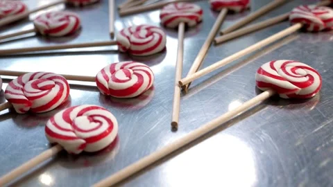 A set of colorful lollipops lie on a table in a pastry shop. Stock-Footage 328025139
