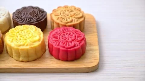 Set of colorful round soap bars on wooden tray Stock Photos