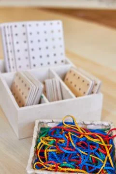 Set of colorful strings and wooden shapes Stock Photos