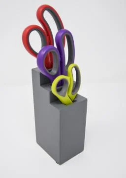 A Set of colourful kithchen scissors in a block Stock Photos