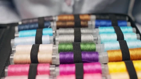 Set of colourful thread spools in sewing box, necessary tools and equipments for Stock Footage 302166181