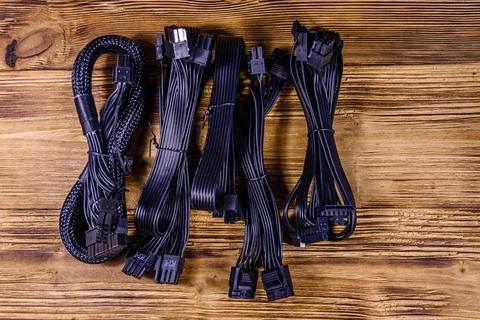 Set of computer psu cables on a wooden background Stock Photos