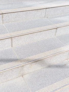 A set of concrete steps with a line of lines on them Stock Photos