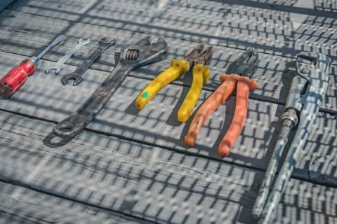 Set of construction and household tools on wooden floor Stock Photos