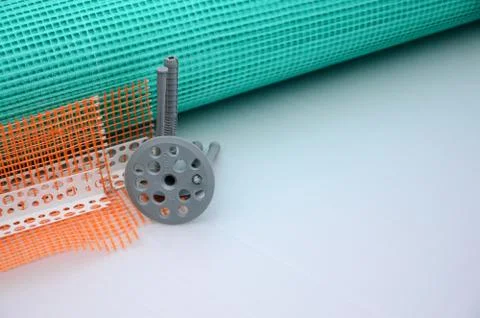 A set of construction items for the insulation of walls. Plastic dowels, a ro Stock Photos