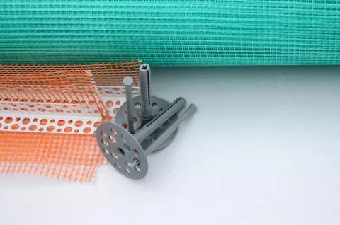 A set of construction items for the insulation of walls. Plastic dowels, a ro Stock Photos