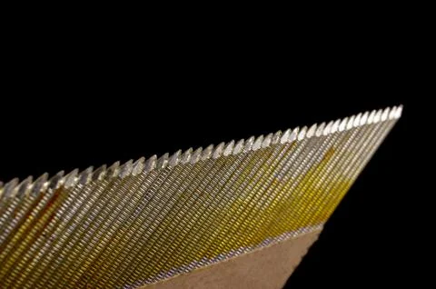 Set of construction nails isolated on the black Stock Photos