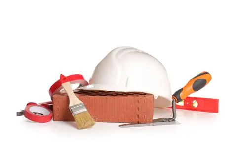 Set of construction tools, brick and hardhat isolated on white background Stock Photos