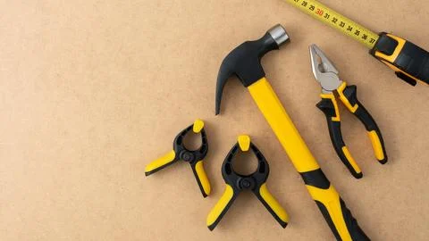 Set of construction tools including hammer, pliers, clamps and tape measure o Stock Photos