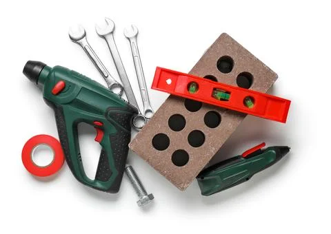 Set of construction worker's tools with brick on white background Stock Photos