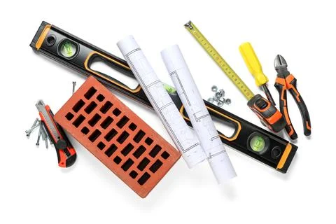 Set of construction workers tools with house plans and brick on white backgro Stock Photos