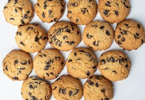 Set of cookies with pieces of chocolate on white background Stock Photos