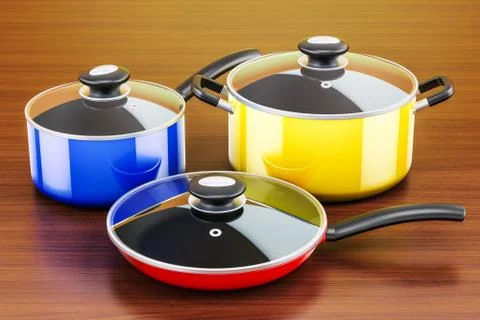 Set of cooking colored kitchen utensils and cookware on the wooden table. 3D  Illustrazione stock