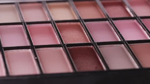 Set of cosmetics powder eye shadows with different shades, close-up. Design Stock Footage 256876629