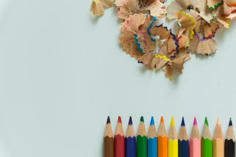 A set of crayons and sharpener on white background Stock Photos