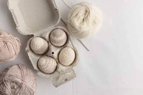 Set of cute easter crocheted eggs, pastel color in the eggbox 写真素材