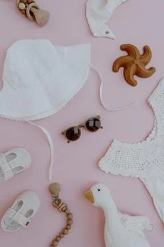 Set of cute summer clothes and accessories for baby girl on pink background.  Fotos Stock