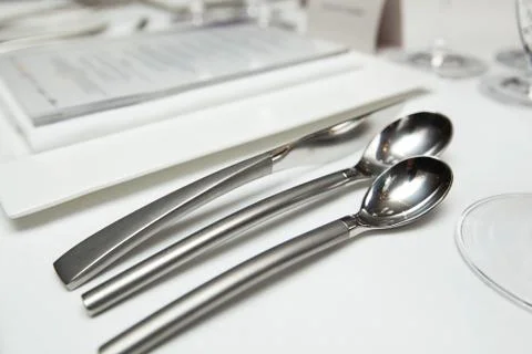 Set up Cutlery on the table for dinner at restaurant Stock Photos