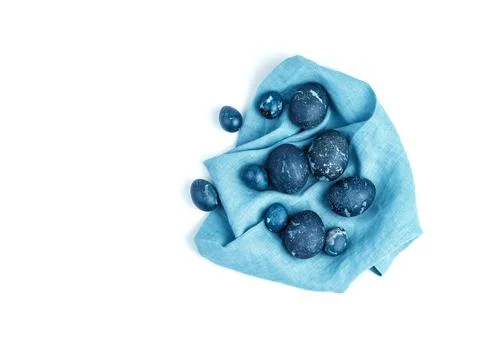 A set of dark blue Easter eggs on a blue napkin. Stock Photos