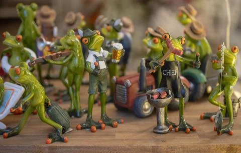 Set of decoration ceramic frogs in various funny poses for home and garden Stock Photos