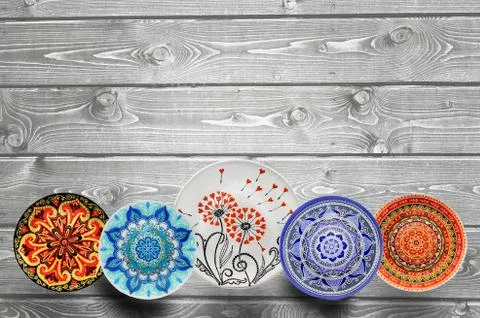 Set of decorative ceramic plates hand painted dot pattern with acrylic paints Stock Photos