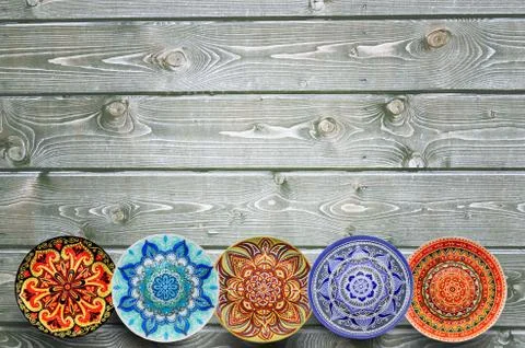 Set of decorative ceramic plates hand painted dot pattern with acrylic paints Stock Photos