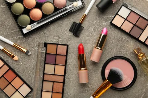 Set of decorative cosmetics on grey background. Stock Photos