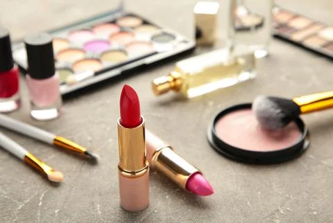 Set of decorative cosmetics on grey background. Stock Photos