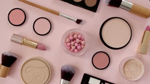 A set of decorative cosmetics on pink background. Makeup products. The beauty of 스톡 동영상 228805035