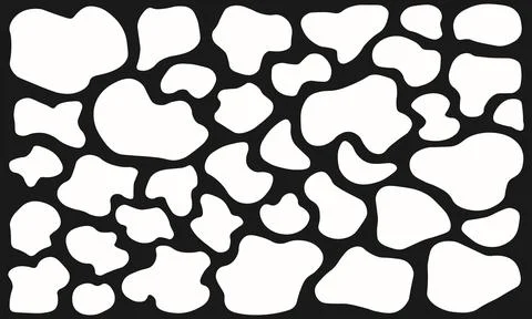 Set of dense small organic blob shapes in white on dark background. Speckle.. Stock Illustration