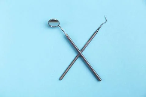 Set of dental instruments on a blue background Stock Photos
