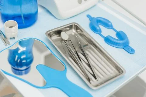 A set of dental instruments on the table in the dentist's office. Stock Photos