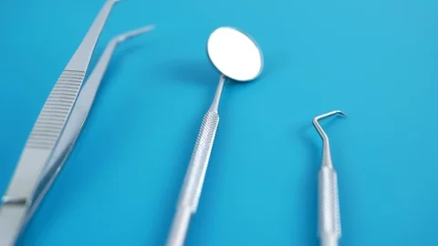 Set of dentist tools on green background Stock Footage 88359209
