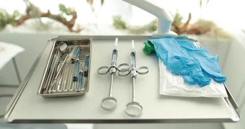 A set of dentist's tools prepared for the procedure. Dental hygiene and hea.. Stock Photos