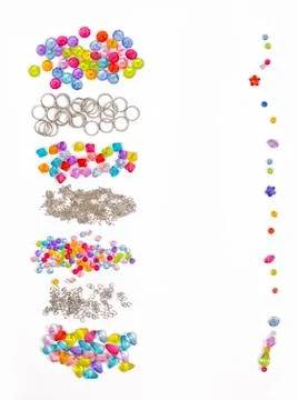 Set for design of colored beads on a white background for the signature, rings Stock Photos