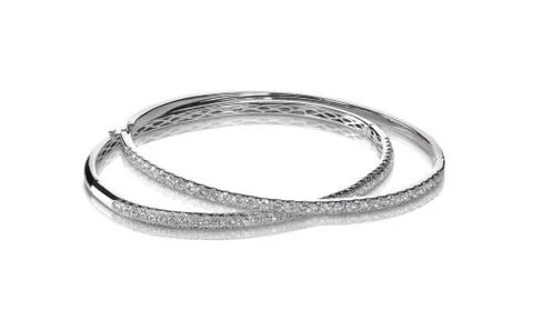 Set of diamond channel set bangle bracelets silver or white gold Stock Photos