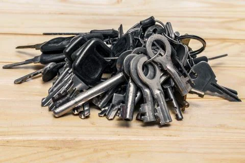 A set of different antique keys on the table Stock Photos