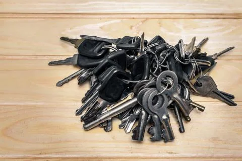 A set of different antique keys on the table Stock Photos