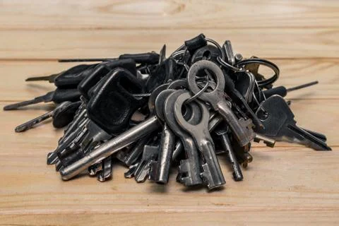A set of different antique keys on the table Stock Photos