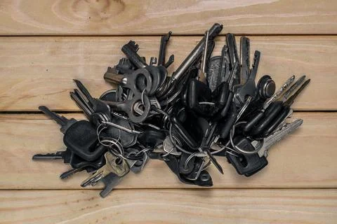 A set of different antique keys on the table Stock Photos