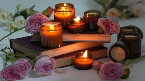 A set of different aroma candles in brown glass jars. Scented handmade candle Stock Footage 202583164