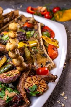 A set of different beef meat dishes on a white plate Foto stock